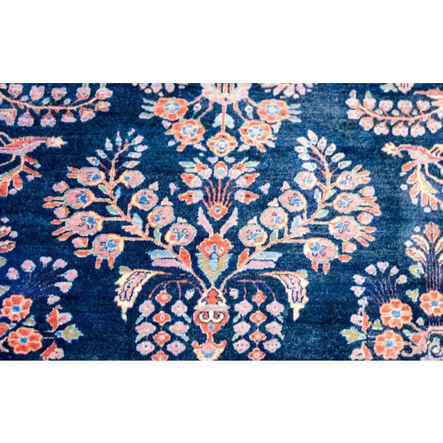 A wonderful and Classic early 20th century Persian Sarouk Mohajeran rug with a traditional mirrored floral pattern woven...