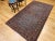4’ 7” x 8’ 1” Vintage hand knotted Persian Kashan area rug in floral pattern set on a wonderful aqua blue field color and...