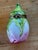 Vintage Limoges trinket box modeled as a closed rosebud, green sepals wrapping down over pale petals that blush to pink...