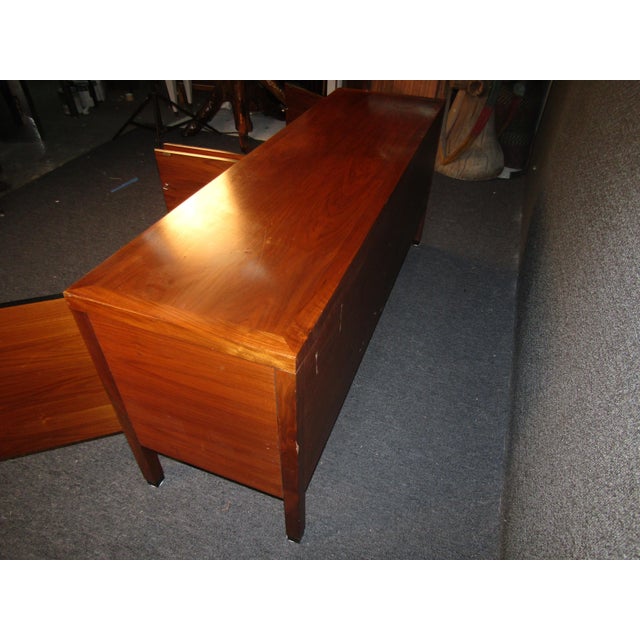 Full of Mid-Century Modern style and quality, this vintage walnut sideboard offers plenty of storage and room for...