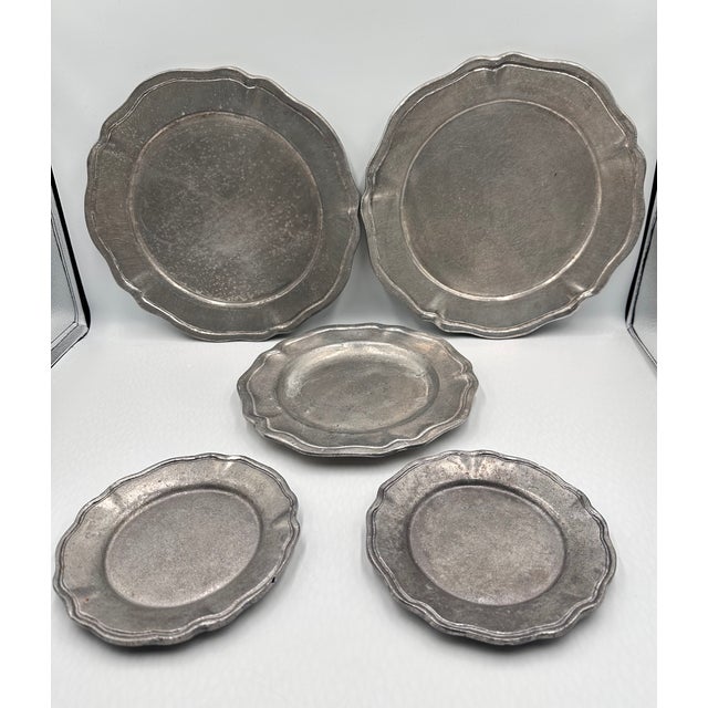 This is a charming collection of antique Gemetal pewter plates, perfect for adding a touch of vintage elegance to your...