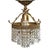 Crafted with an ornate brass frame, it features a decorative scrolled crown accent and detailed relief patterning along...
