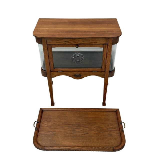 Stunning and rare Art Nouveau tea cabinet. Striking Dutch design from the 1900s. Solid oak frame with original curved...