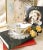 This classic hand-painted double spouted porcelain sauce boat represents the historic artistic legacy of the Herend...
