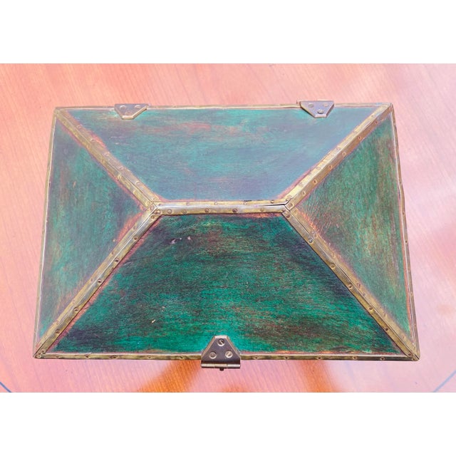 This is a vintage pyramid shaped dresser box that has been trimmed with solid brass and a solid brass clasp at the front....