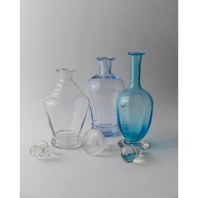 This vintage Murano glass decanter set from 1950s Italy includes three sculptural pieces in harmonizing yet distinct...