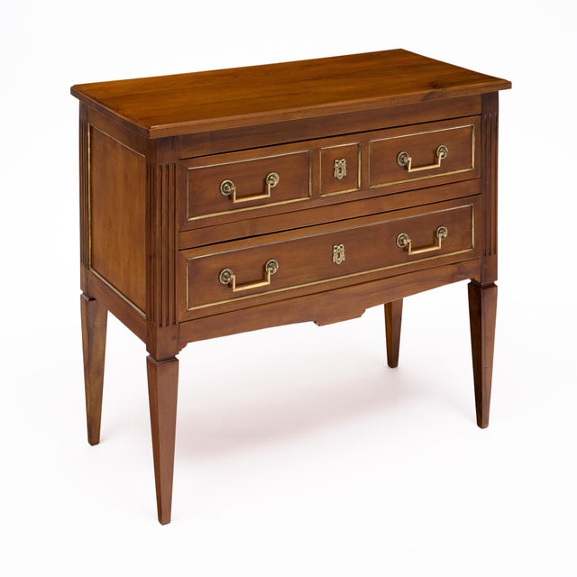 An elegant French Louis XVI Directoire style commode, circa 1790, crafted in walnut in the Rhône Valley of France and...