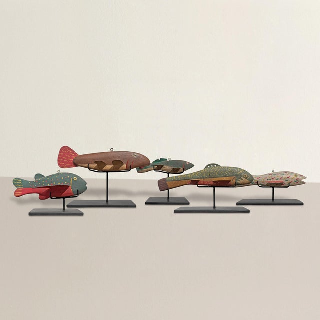 This collection of five vintage American fishing decoys brings a hit of northern Wisconsin folk art straight into the...