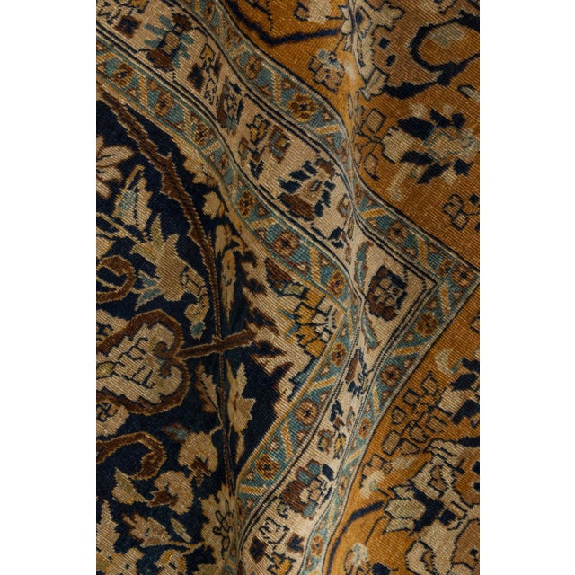 A late 19th century Persian Tabriz carpet, the midnight blue field with a Safavid Isfahan design with its palmette and...