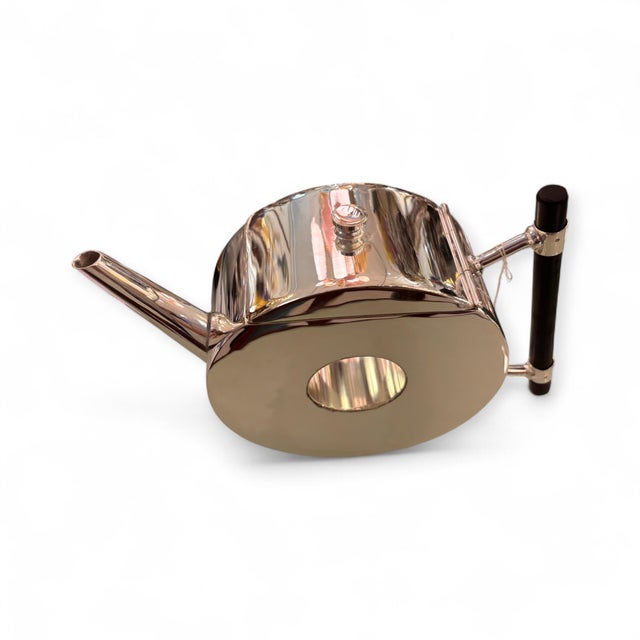 Alpaca teapot by British designer Christopher Dresser, made around 1879 in England. The teapot features a hollow center, a...