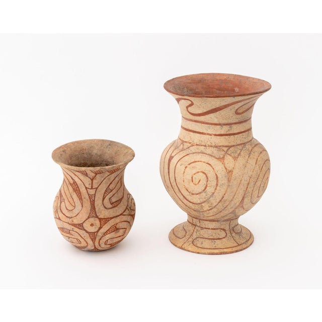 Two Thai Ban Chiang Pottery Vessels, third or second century B.C., bi-chrome red-on-buff ceramic. Larger: 10.75" H x 7.25"...