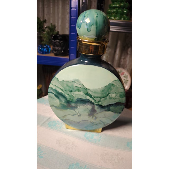 This Ceramic Decanter was most likely made by a small design studio, hence the makers mark on the bottom of the piece. The...