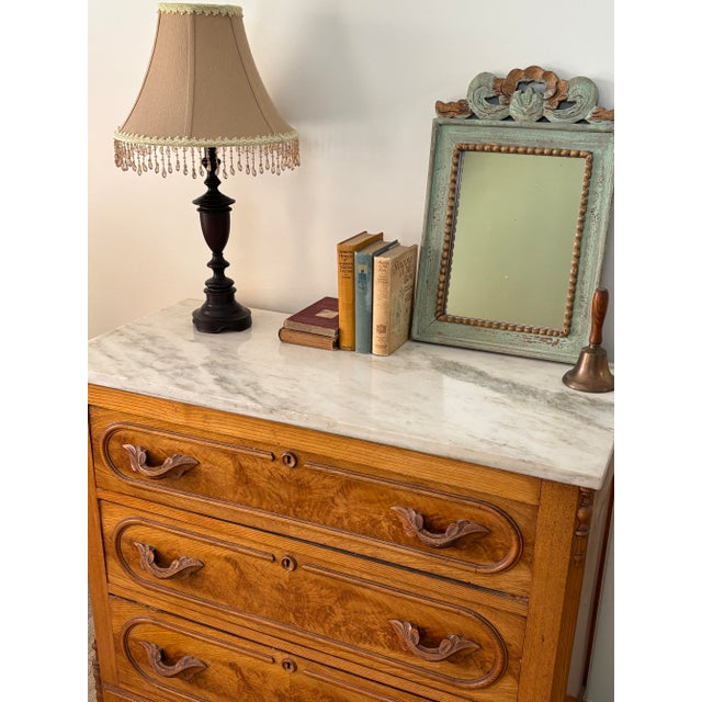 A spectacular 19th-century American Victorian antique three-drawer dresser with a stunning marble top. This exceptionally...
