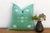 A crisp white star motif sits above a double-row dotted border on this handcrafted Moroccan cactus silk pillow, hand-...