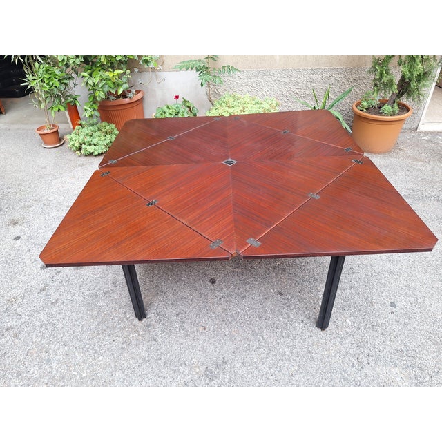Vintage T92 Dining Table in Rosewood by Eugenio Gerli, 1960s, in Very Good conditions. Designed 1960 to 1969 I have...