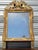 Very old mirror, 19th century, Louis XVI style. Original mercury mirror. Two-tone wood and stucco frame, painted in golden...