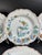 A charming set of four Italian faience plates with hand-painted polychrome bird and floral decoration in the traditional...