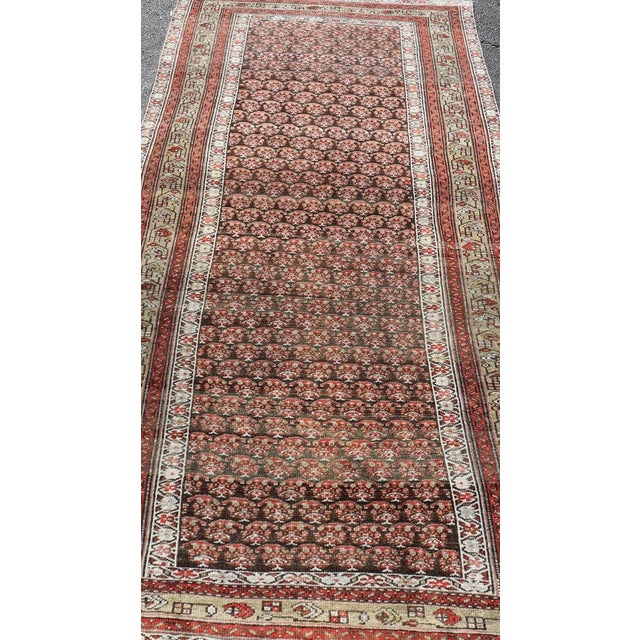 Antique Kurdish Gallery Runner with All-Over Paisley Design in Brown, Red, Green. Keivan Woven Arts / rug EMB-22230-15466,...