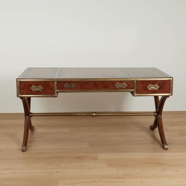 Handsome stylized campaign desk crafted in mahogany featuring three tooled leather panels on a brass banded case with...