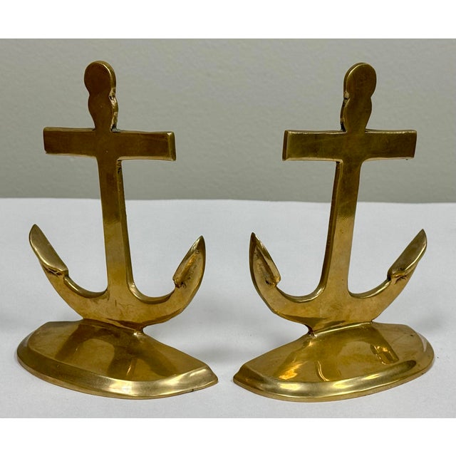 Vintage brass anchor bookends will give a fun coastal or nautical vibe to your space! Lovely patina.