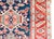 An exquisite antique Persian Heriz rug from the 1920s, hand-woven with high-quality wool and natural dyes. This piece...