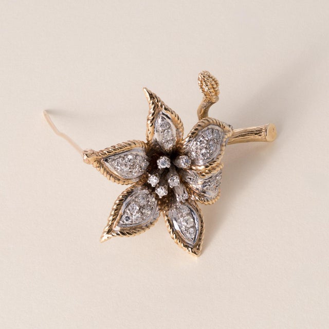 Vintage Floral Diamond Brooch 14K Two-Tone Gold | Circa 1960s This elegant vintage brooch from the 1960s beautifully...