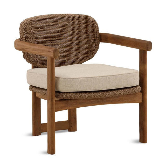 Outdoor accent arm chair with attractive warm brown faux wicker woven back and seat and teak wood frame. Rounded modern...