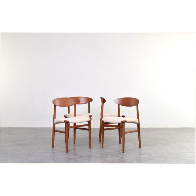 A set of four dining chairs designed by Ejner Larsen and Aksel Bender Madsen, two of the most respected figures of Danish...