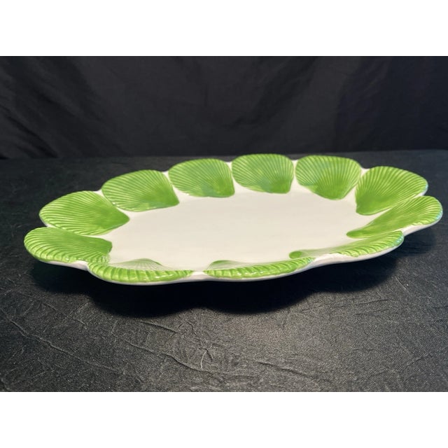 Serve in style with this vintage Fitz & Floyd ceramic platter, beautifully decorated with green scallop shell accents...