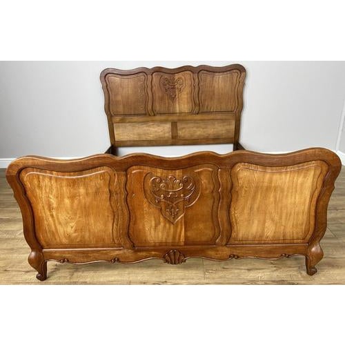 A stunning Vintage French Louis double bed frame , featuring elegant curves and beautifully carved detailing that...