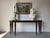 Elegant and timeless, this large mahogany console table by Baker Furniture, designed by Barbara Barry, embodies the...