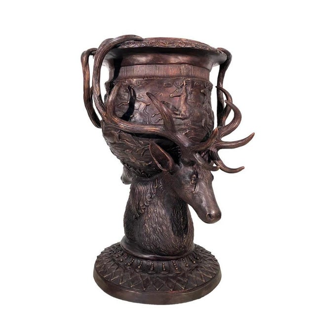 Gorgeous pair of large bronze urns adorned with stags heads and antlers Good size at over four feet tall - 125 CM A...