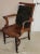 Circa 1900, French Art Nouveau walnut desk chair with very comfortable sculpted seat. The back is upholstered with a dark...