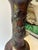 An antique Japanese Meiji period Bronze vase, lamp, features detailed relief carvings of birds and natural motifs...