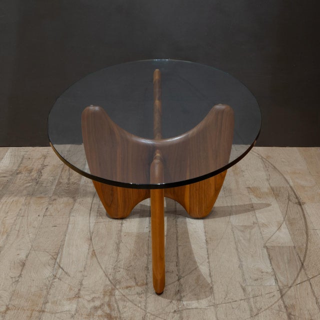 ABOUT The sculptural shape of our Sanders coffee table is inspired by mid-century design. Thick slabs of solid wood are...