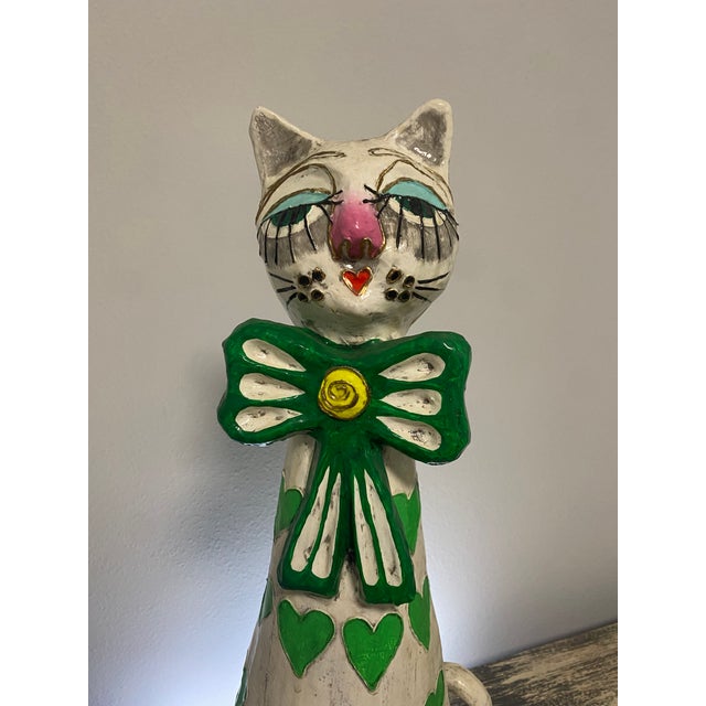 Whimsical vintage seated cat sculpture attributed to Jeanne Valentine, handcrafted from papier-mâché and finished in...