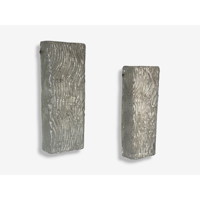 Swedish Modern, Textured and Swirled Glass, Nickel, Wall Lights, Sweden, 1970s A pair of textured glass and nickel wall...