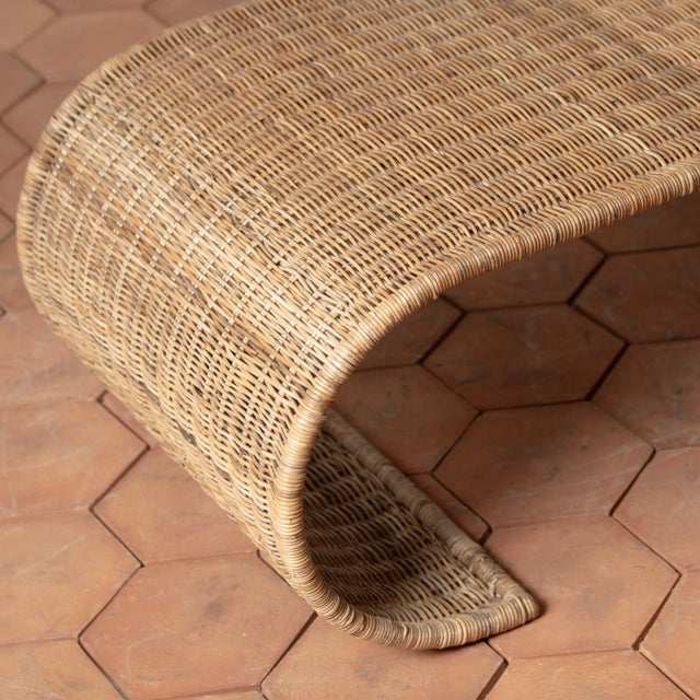 With a distinctive, sculptural silhouette inspired by mid-century waterfall tables, the Healdsburg Wicker Coffee Table...