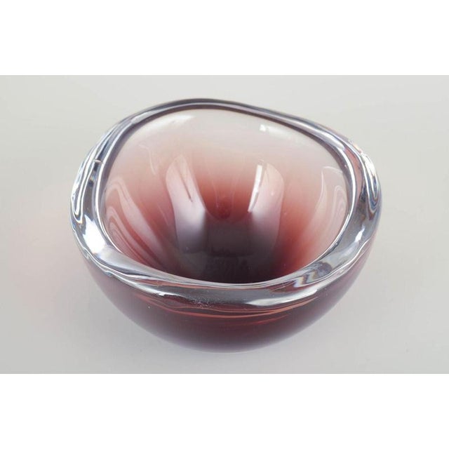 Murano Art glass bowl, 1960s. Organically shaped bowl in mouth-blown glass with layered colour effects in deep ruby and...