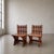 A fabulous and highly individual pair of handcrafted solid mahogany chairs, combining bold construction with a distinctly...