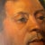 A striking vintage mid-century oil portrait featuring an African American male figure set against a bold golden yellow...