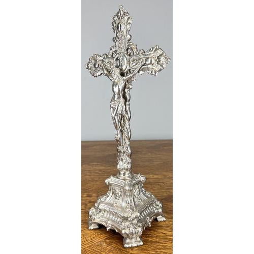 An impressive Vintage French crucifix crafted in metal, richly detailed with classical religious ornamentation and a...