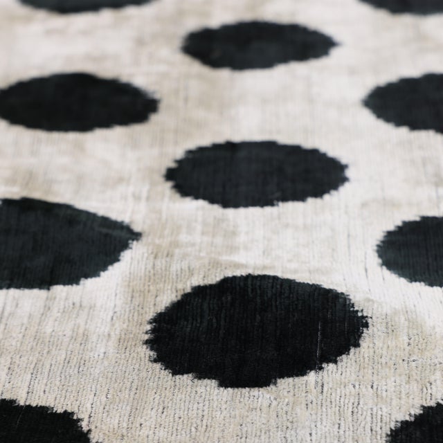 "Introduce a playful yet sophisticated graphic element to your residential curation with this masterfully hand-knotted...