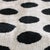 "Introduce a playful yet sophisticated graphic element to your residential curation with this masterfully hand-knotted...