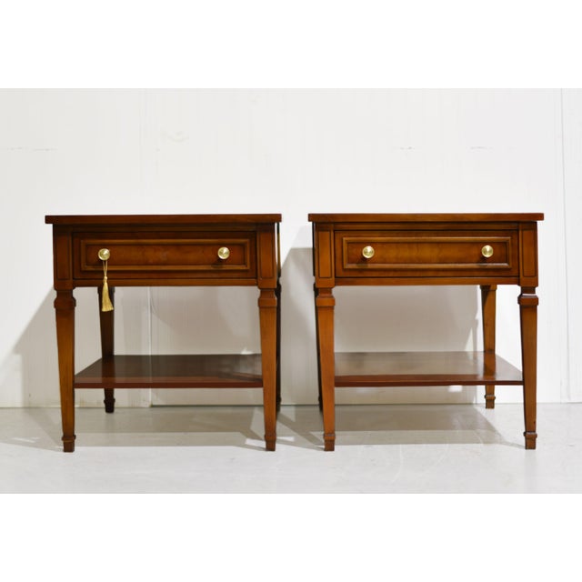 A pair of solid wood side tables — refined, collected, and built to last. The transitional silhouette bridges mid-century...