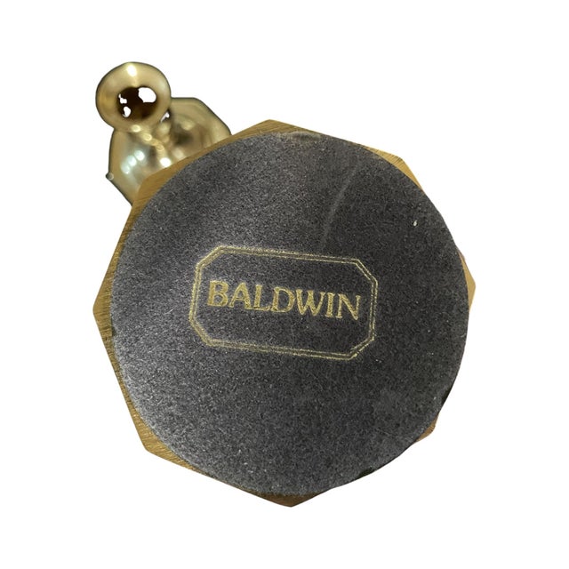 A pair of vintage midcentury MCM polished brass gold tone candlesticks/candleholders from Baldwin Brass. Approximately...