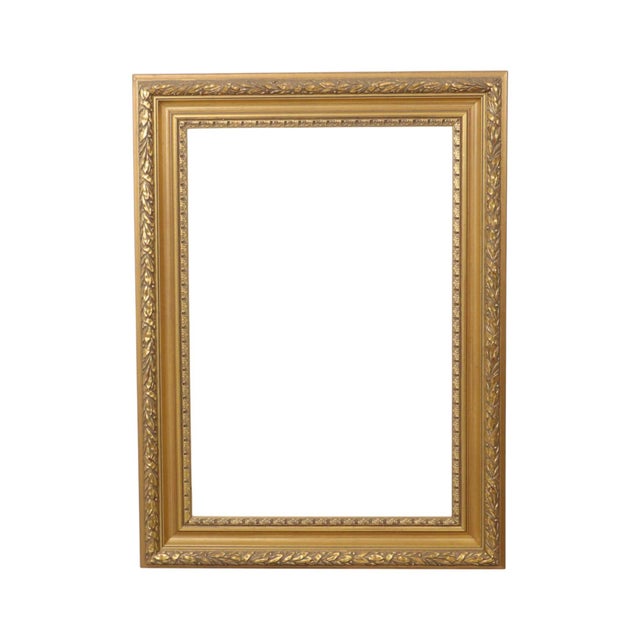 An antique-style wooden frame with a gold-colored finish and a beautiful patina; executed in a classic Baroque or Rococo...