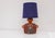 A rare and sculptural ceramic table lamp known as "törsö gumman" (the round lady from törsö) designed by thomas hellström...