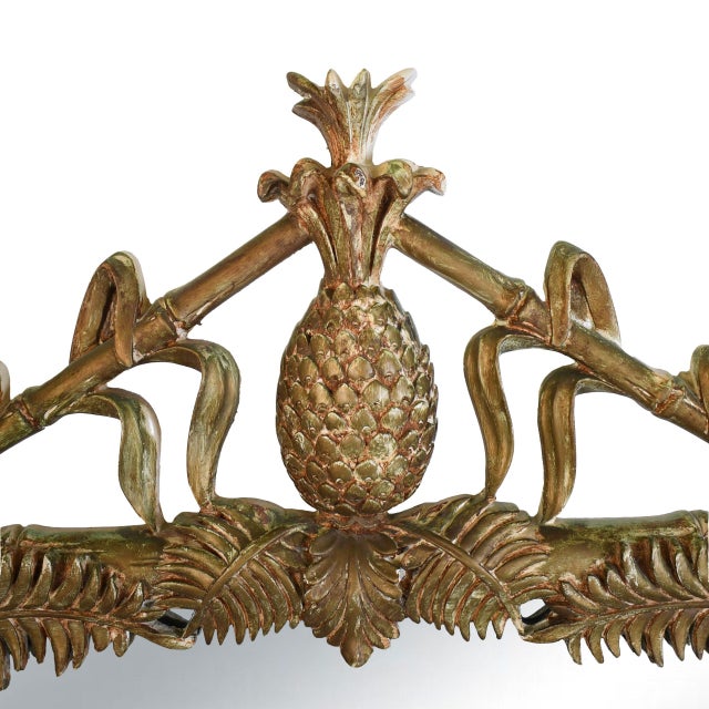 A signed Gampel Stoll pineapple mirror framed in gilt bamboo with a carved pineapple crest — the ultimate symbol of...
