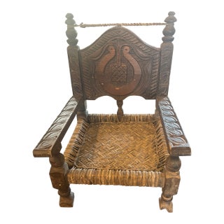 Early 20th Century Folk Art Nuristan Hand Carved & Cane Cedar Low Chair For Sale